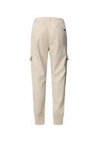 Beige cargo trousers with an elastic waistband, ribbed cuffs, side pockets, and two back pockets. Made of soft cotton-blend fabric.