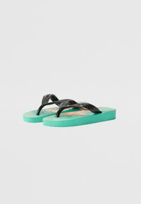Black rubber flip-flops with a textured strap and a turquoise footbed featuring a colorful graphic design and striped pattern.