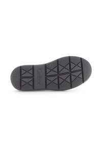 Black rubber shoe sole with textured grip patterns and triangular treads. Marked with "Gabor" logo near the heel for brand identification.