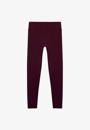 Leggings bordeaux en tissu extensible, dotés d'une taille haute et d'une texture lisse, avec un design ajusté et sans coutures visibles.