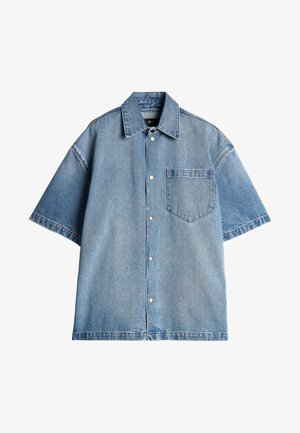 Light blue denim short-sleeve shirt with a pointed collar, front pocket, and snap-button closure; features a relaxed fit and no patterns.