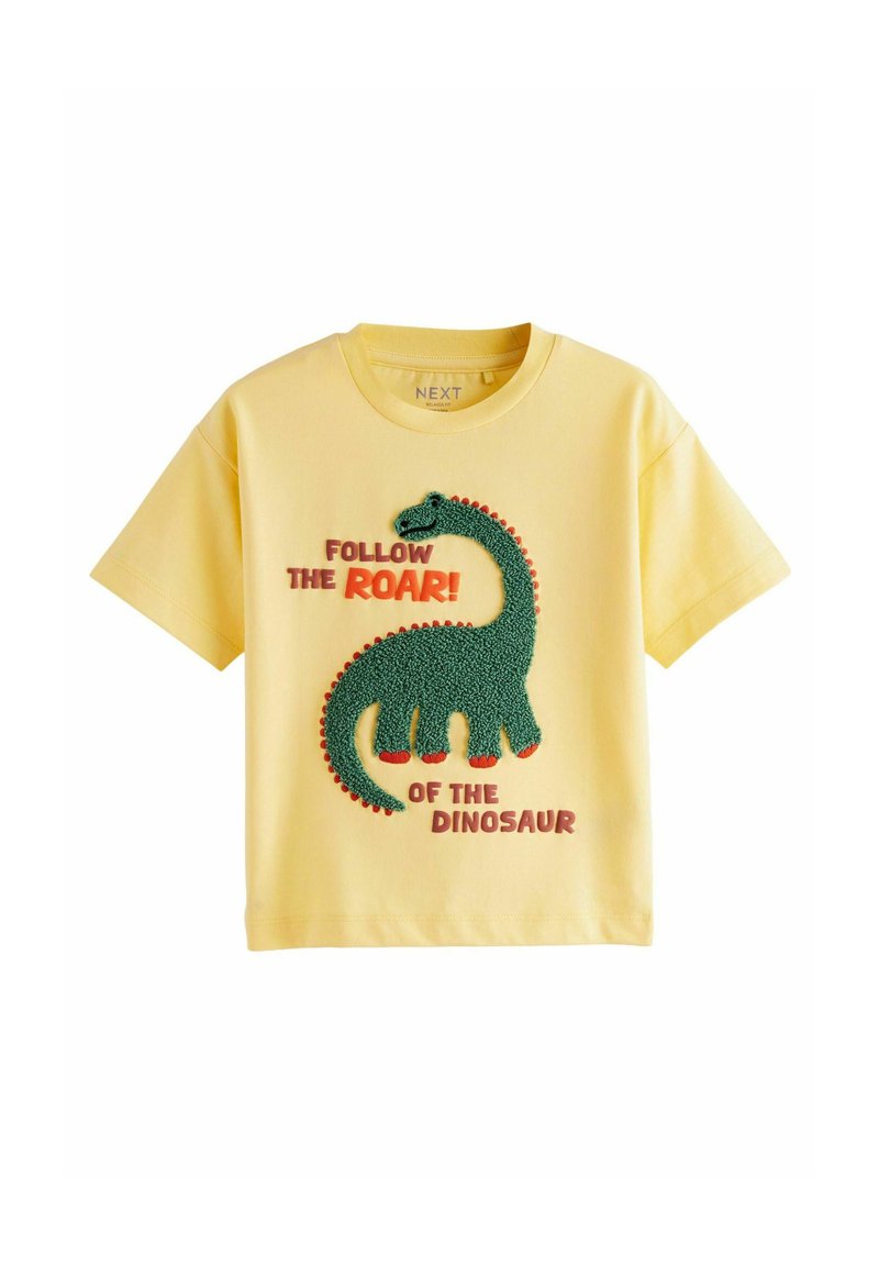 Gul bomulds T-shirt med et tekstureret grønt dinosaurgrafik med røde accenter og fed tekst: "FØLG BRØLET! FRA DINOSAUREN."