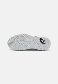 White rubber outsole with textured grip patterns, featuring a central logo. Smooth transition from heel to toe, designed for traction.