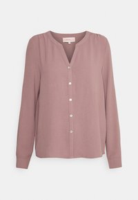 Blusa a maniche lunghe in rosa antico, con scollatura a V, chiusura con bottoni, spacco laterale e texture di tessuto morbido. I bottoni argentati aggiungono un tocco di dettaglio.