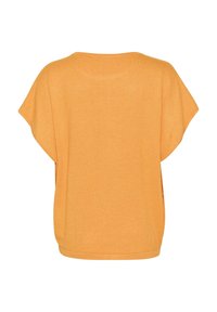 Lyhythihainen, rento keltainen paita pehmeästä kankaasta. Pyöreä kaula-aukko, jossa sileä pinta, sisältäen yksinkertaisen suunnittelun ilman kuvioita.