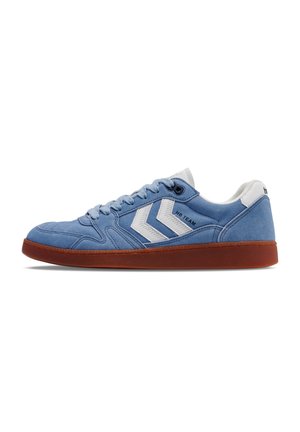 Blue suede sneaker with white accents, featuring a flat rubber sole, round toe, and textured stitching details. Lace-up design.
