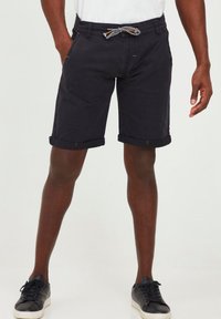 Black denim shorts with rolled cuffs, featuring a contrasting drawstring and visible yellow stitching. Standard fit with side pockets.