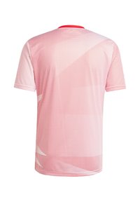 Punainen lyhythihainen T-paita, jossa on pistekuvio. Crew-neck -kaulus. Kevyt, sileä kangas, jossa on hieman tekstuuria.