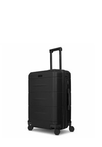Schwarzer Hartschalenkoffer mit strukturierter Oberfläche, glatten Rädern, ausziehbarem Griff und Reißverschlussverschluss. Verfügt über minimalistische Designlinien.