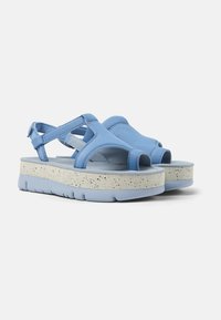 Blue sandals with an open-toe design, adjustable straps, and a textured cream sole. Features a cushioned footbed and lightweight construction.