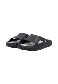 Black slide sandals made of flexible material, featuring an open design with cutouts, a soft white interior, and a textured sole for grip.