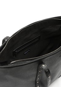 Black leather handbag featuring a zip closure, studded handles, and a spacious interior with a side zip pocket and brand label.