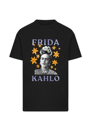Black cotton t-shirt featuring a graphic print of Frida Kahlo in black and white, surrounded by orange flowers and purple text.