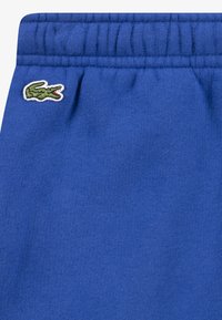 Lacoste CORE PANT UNISEX - Tepláky - blue