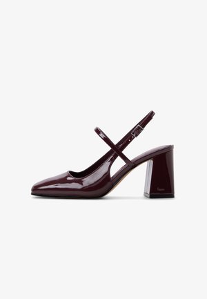 Glossy dark burgundy slingback pump with block heel and thin adjustable strap.