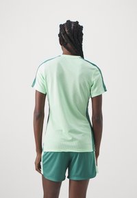 Nike Performance TOP BRANDED - Spordi T-särk - vapor green/bicoastal/bicoastal
