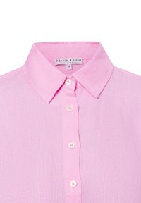 Light pink linen shirt with a button-down collar, featuring white buttons and a textured fabric. Tag reads "Marie Lund, Copenhagen, 36."