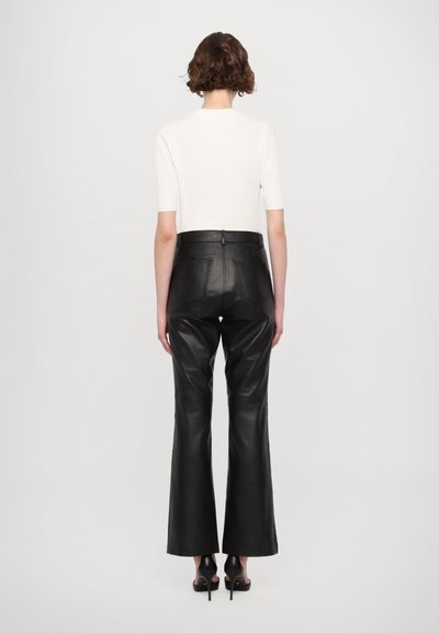 STUDIO ID DANA  - Leather trousers - black