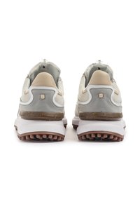 Grey and beige athletic shoes with mesh and leather upper, textured rubber outsole, and padded collar. Features lace-less design and logo detail.