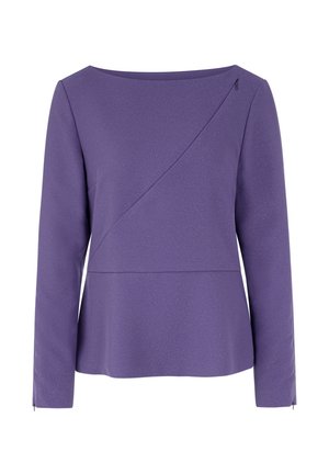 Purple long-sleeve top with a round neckline, diagonal front seam detail, textured fabric, and subtle shimmer. Side openings enhance comfort.