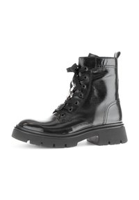 Black patent leather ankle boots with a lace-up design, chunky rubber sole, and metal eyelets. Features a pull tab at the back.