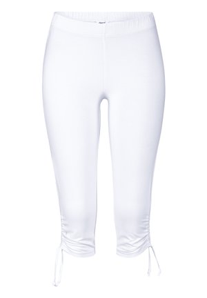 White capri leggings made of stretchy fabric, featuring an elastic waistband and drawstring accents at the hem for adjustable fit.
