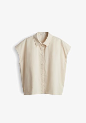 Blusa beige a maniche corte con colletto appuntito, vestibilità ampia e cinque bottoni frontali, mostrata su sfondo bianco.