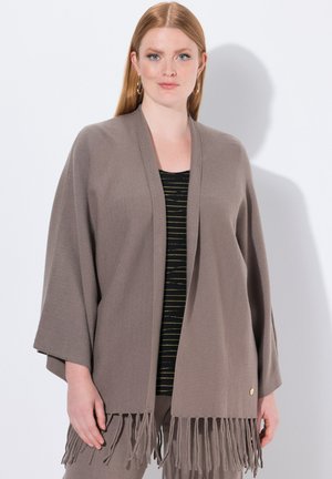 Cardigan marrone aperto davanti con maniche ampie e dettagli in frange all'orlo. Realizzato in tessuto morbido, presenta una leggera texture.