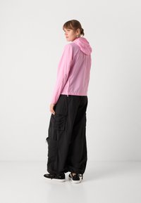 Tommy Jeans OUTDOOR JACKET - Summer jacket - carnival pink