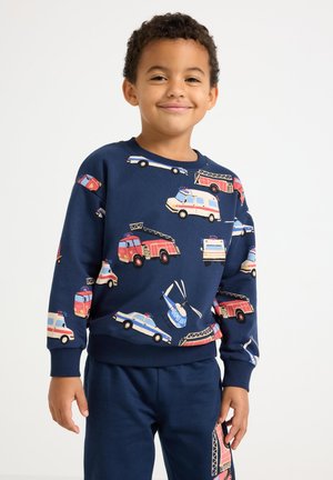Marineblauwe sweatshirt met verschillende voertuigen, waaronder brandweerwagens, politiewagens en helikopters. Geribbelde manchetten en zoom.