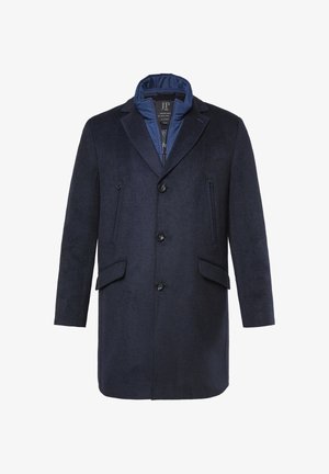 Marineblauer Wollmantel mit strukturierter Oberfläche, großen Revers, drei Knöpfen vorne und zwei Seitentaschen. Innenkragen mit blauem Nylon gefüttert.