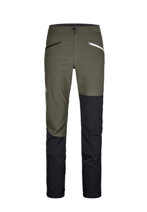 Flexibility pants in green and black with a fitted design. Features side zip pockets, and contrast panels at the thighs and cuffs.