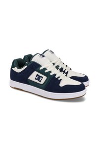 Blue and white athletic sneakers with suede and leather materials, featuring a padded collar, lace closure, and rubber sole. Logo on the side.