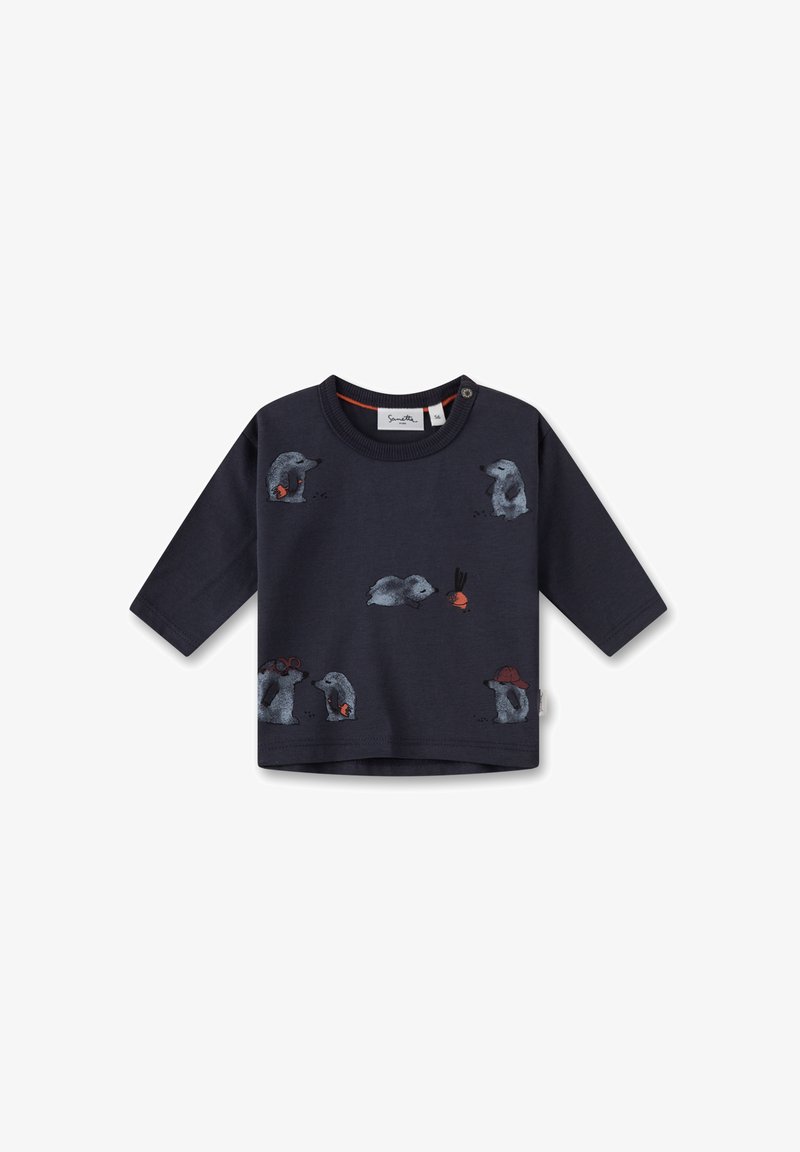 Dunkelblaues Langarmhemd mit gestickten Tiermotiven, darunter ein Igel, und kontrastierendem orangenem Nackenband sowie Knopfdetails.