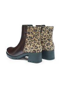 Brown leather ankle boots with a leopard print suede panel, featuring a chunky black heel and side zipper detail.