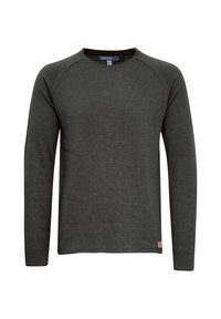 T-shirt à manches longues avec col rond en gris foncé, fabriqué en tissu texturé. Comprend des manches raglan et une petite étiquette logo près de l'ourlet.
