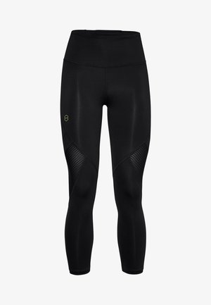 Musta urheiluhousut korkealla vyötäröllä, joissa on verkko-paneelit sivuilla ja pieni logo kontrastivärisessä vihreässä. Sileä pinta.