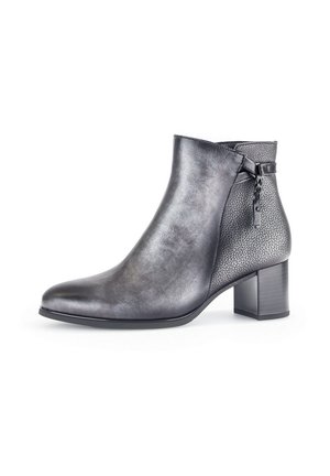Black leather ankle boot with a textured panel, pointed toe, and a medium block heel. Features a braided detail on the side.