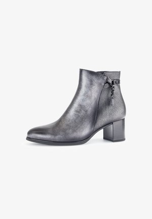 Black leather ankle boot with a textured panel, pointed toe, and a medium block heel. Features a braided detail on the side.