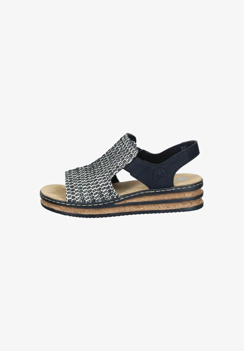 Woven fabric sandal with a navy blue and white pattern, cork platform, and an adjustable back strap. Rubber sole for traction.