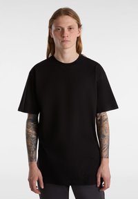 Black short-sleeve T-shirt with a relaxed fit and round neckline. Made from soft fabric, featuring a plain design without additional patterns.
