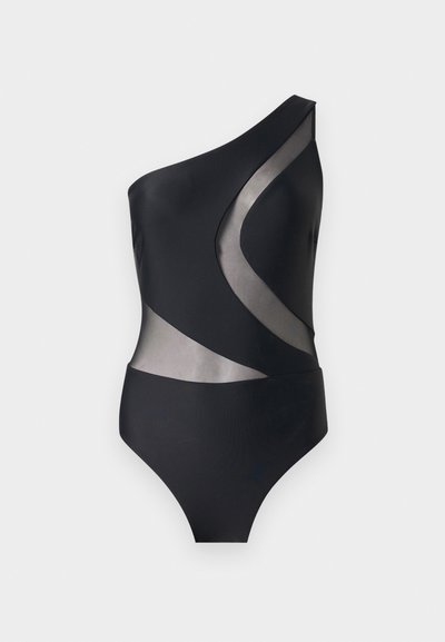 Maillot de bain noir asymétrique avec des panneaux incurvés en mesh transparent à l'avant et sur le côté, coupe simple, et ouvertures de jambes échancrées.