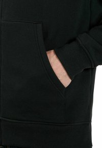 Sweat à Capuche Zippé Berghaus Homme – Coupe-vent Noir – Taille XL – Occasion état Parfait