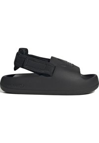 Svart slip-on sandal tillverkad av texturerat gummi med bakrem, som har en upphöjd logotyp och öppen tådesign för andningsförmåga och komfort.