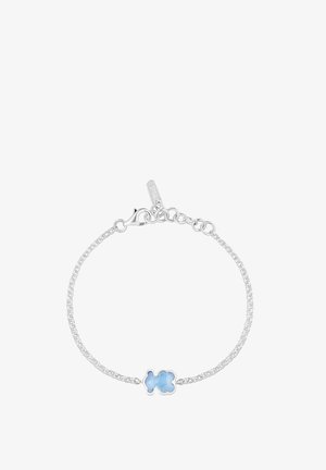 Pulsera de cadena de plata con una piedra preciosa azul en forma de oso, con cierre de langosta y una cadena ajustable para personalizar la longitud.