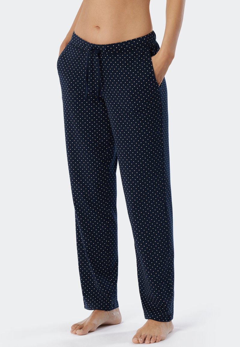Marinblå pyjamasbyxor i mjukt tyg, med ett prickmönster, elastisk midja med dragsko och sidofickor.