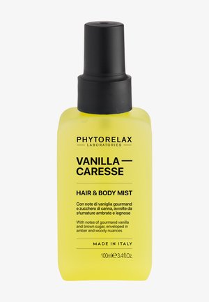 Flacon spray jaune de Phytorelax Vanilla Caresse brume pour cheveux et corps avec bouchon noir, 100 ml, fabriqué en Italie.