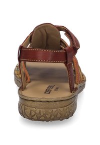 Brown leather sandal featuring an open back, multiple straps, textured sole, and logo on insole, designed for comfort and breathability.