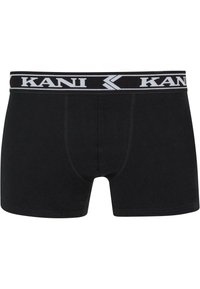 Fekete boxer alsónadrág pamutból, fehér márkázott elasztikus derékpánttal. Illeszkedő kialakítással és lapos varratokkal a kényelem érdekében.