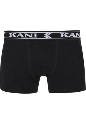 Schwarze Boxershorts aus Baumwolle mit einem weißen elastischen Bund mit Logo. Sie bieten eine figurschmeichelnde Passform und flache Nähte für zusätzlichen Komfort.